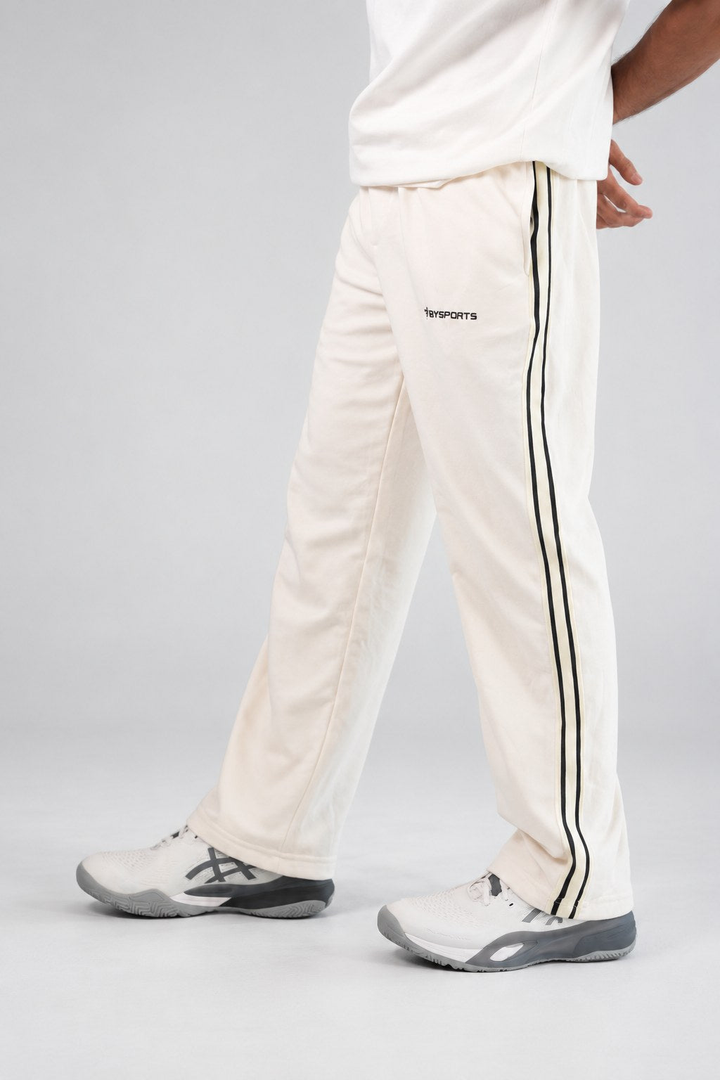 BYSPORTS Premium Side-Stripe Trouser For Men & Women – Cream, side view on model | BYSPORTS