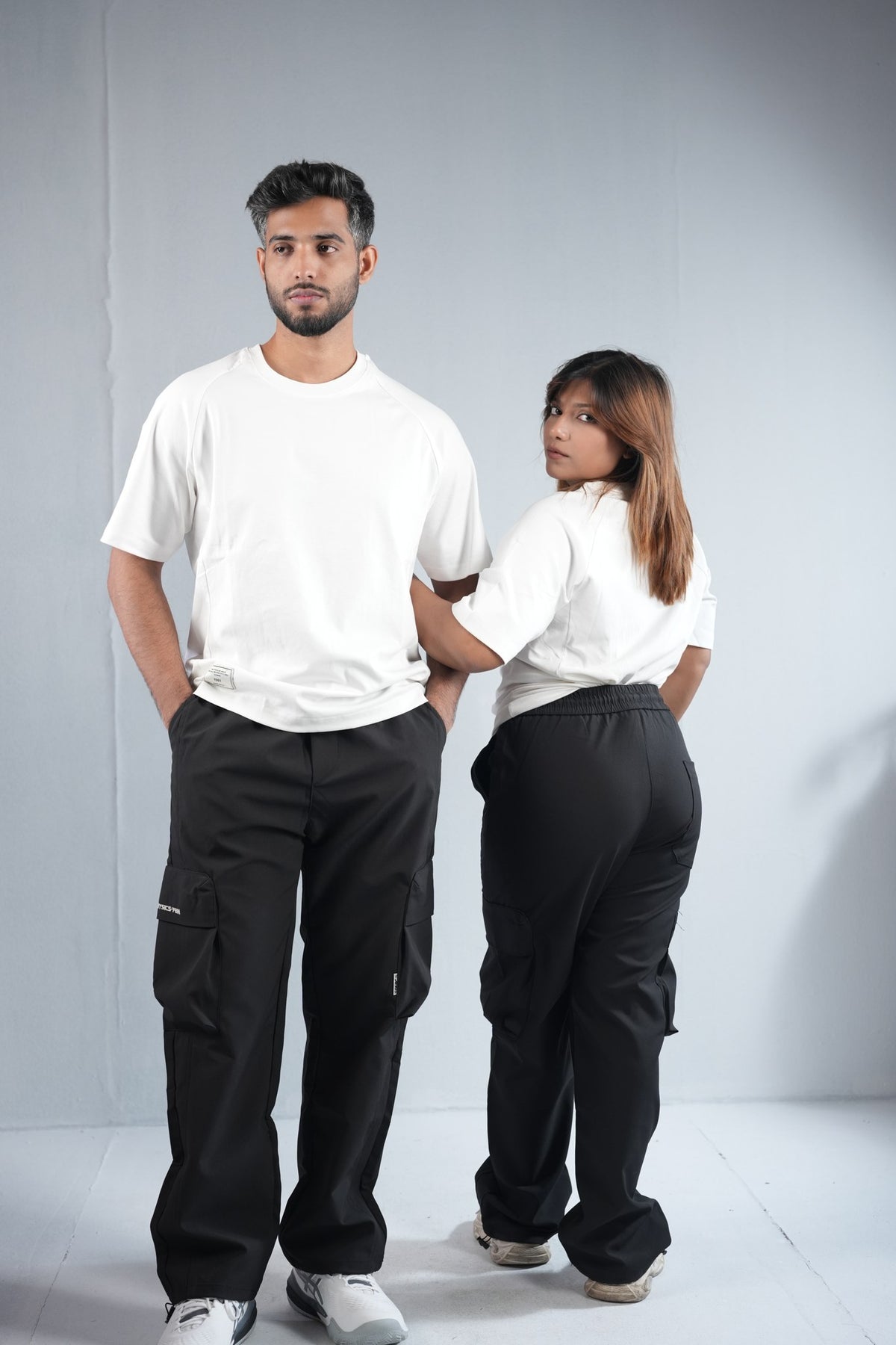 Premium Cargo Pant For Men & Women – Black, worn by male and female models 3 | BYSPORTS