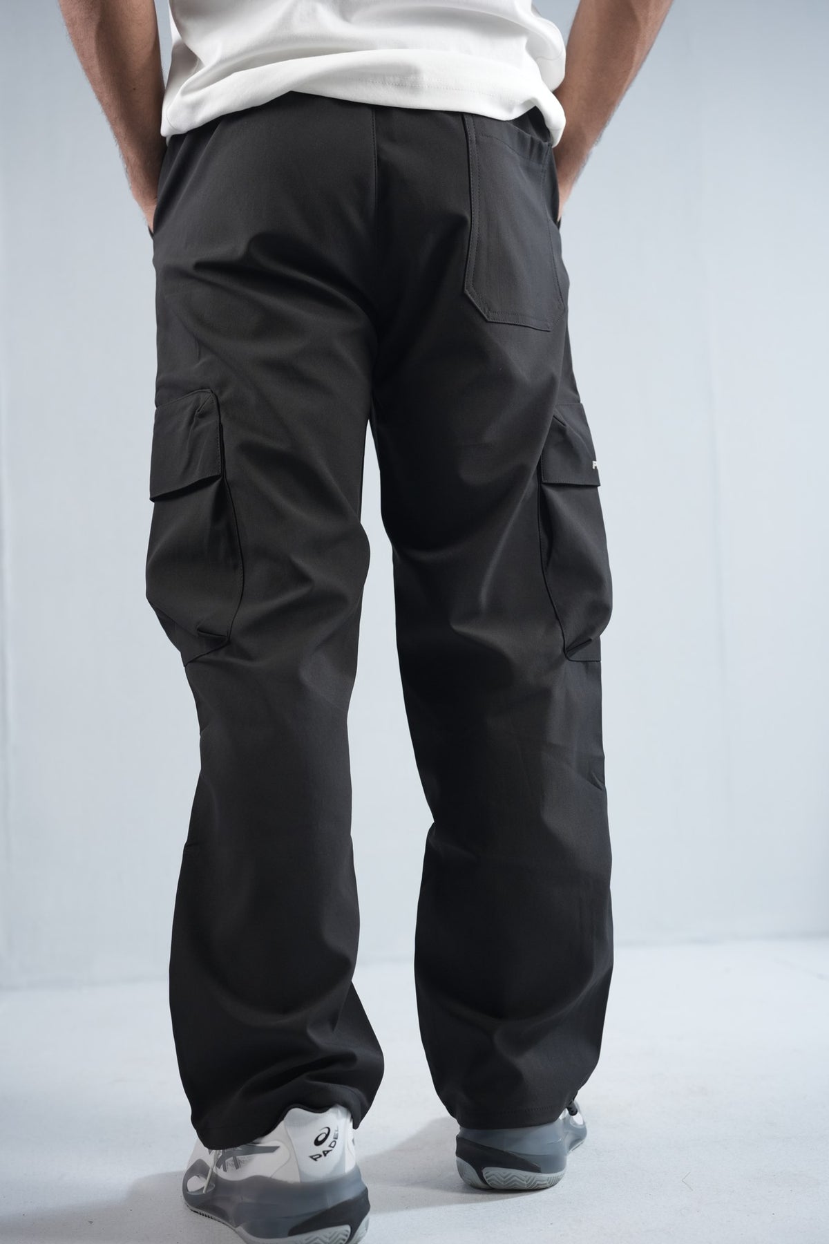 Premium Cargo Pant For Men & Women – Black, side view on model 2 | BYSPORTS