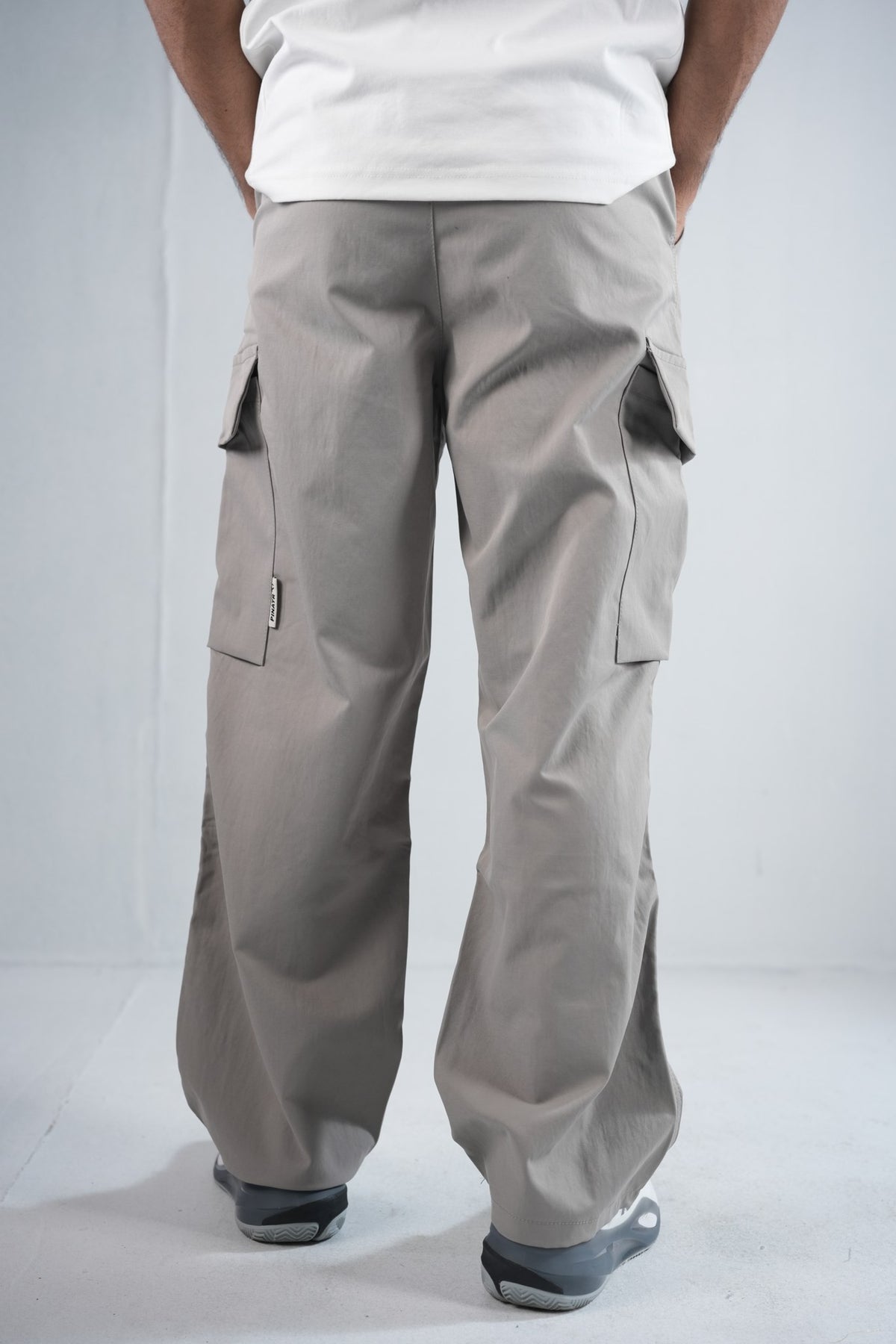 Premium Cargo Pant For Men & Women – Stone Grey, side view on model 2 | BYSPORTS