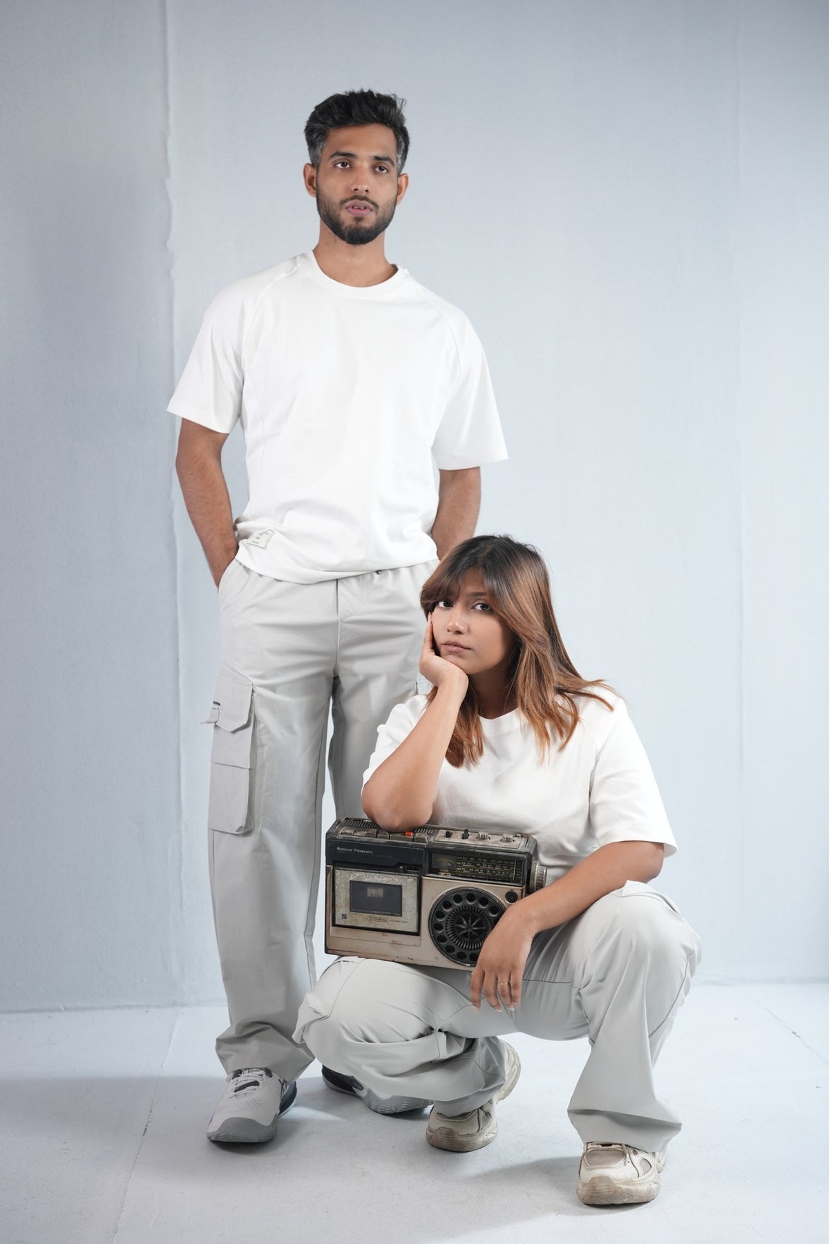 Premium Multi-Pocket Cargo Pant For Men & Women – Light Grey, worn by male and female models 3 | BYSPORTS