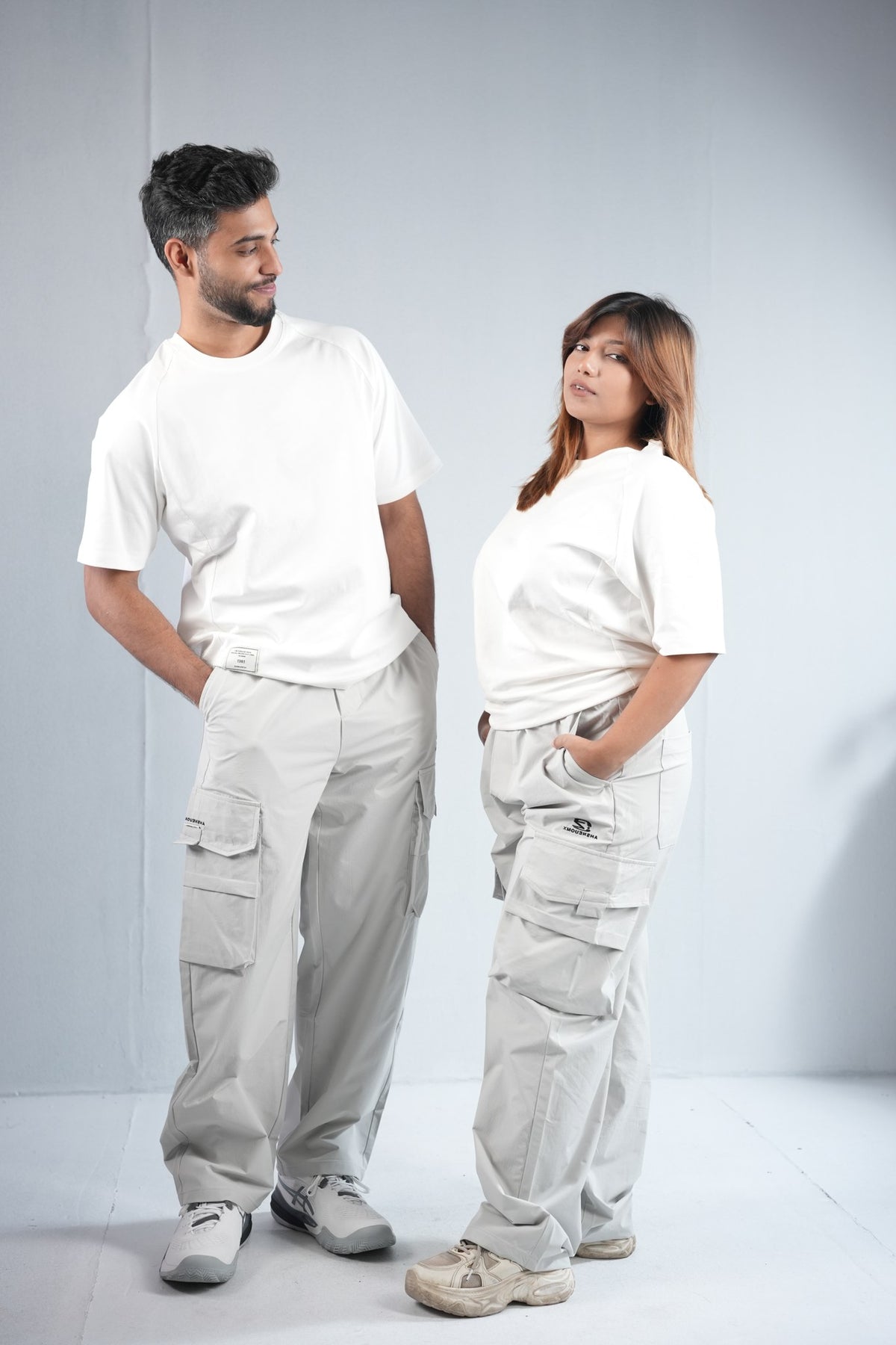 Premium Multi-Pocket Cargo Pant For Men & Women – Light Grey, worn by male and female models 5 | BYSPORTS