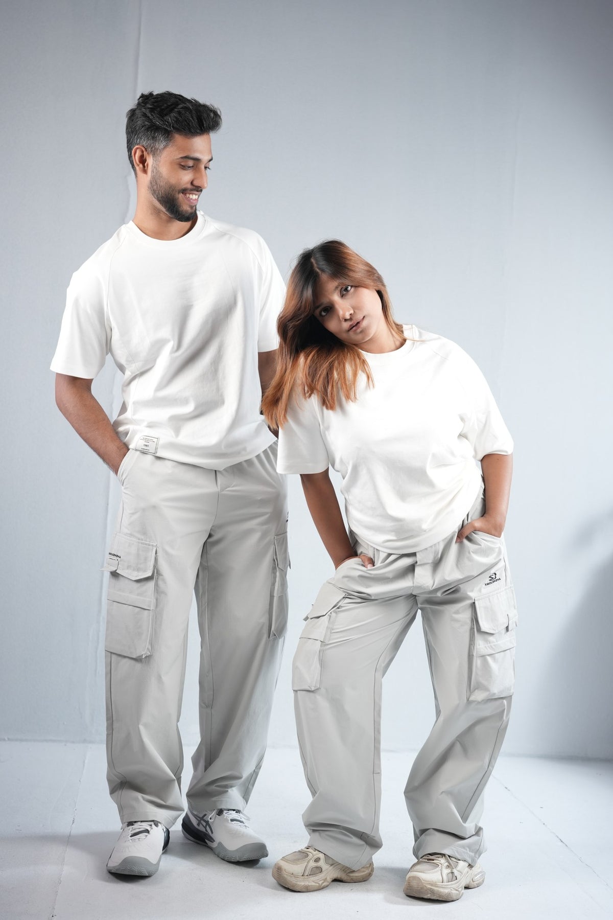 Premium Multi-Pocket Cargo Pant For Men & Women – Light Grey, worn by male and female models 6 | BYSPORTS