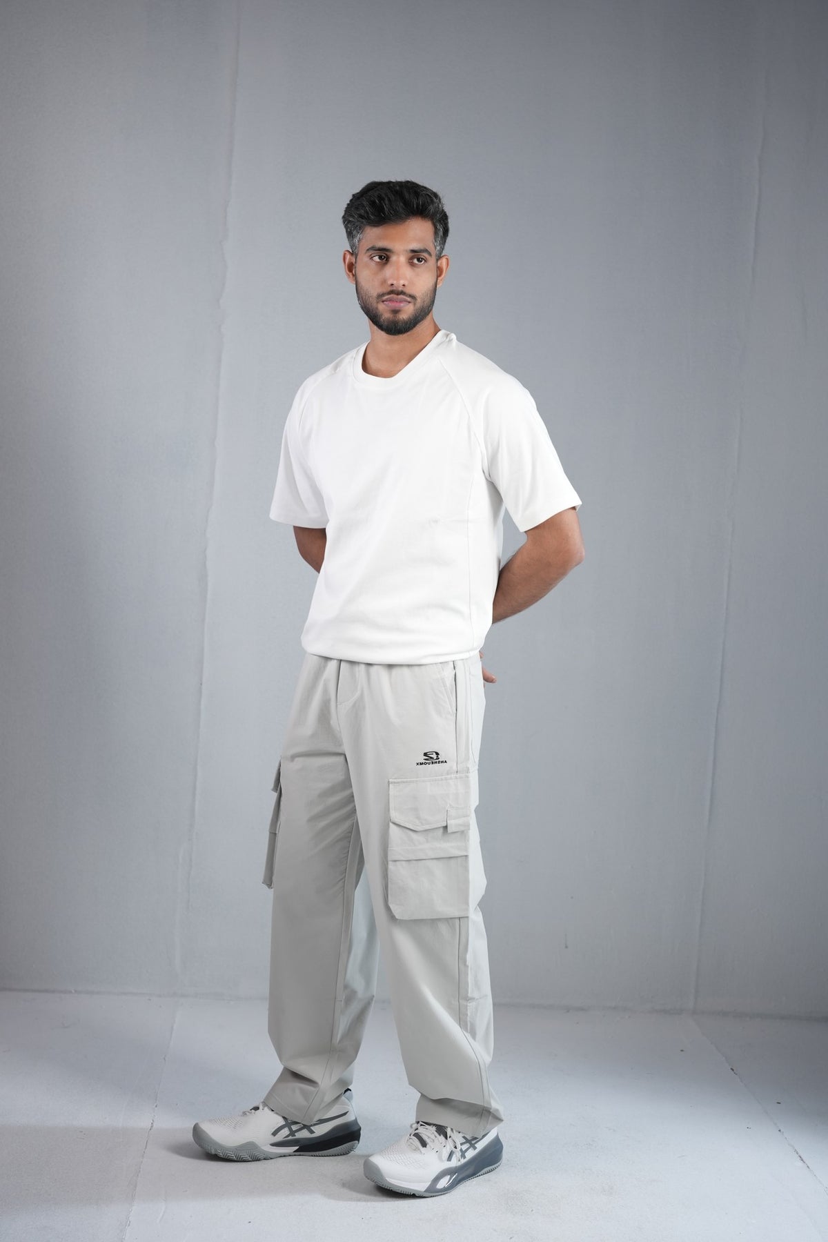 Premium Multi-Pocket Cargo Pant For Men & Women – Light Grey, worn by model 2 | BYSPORTS