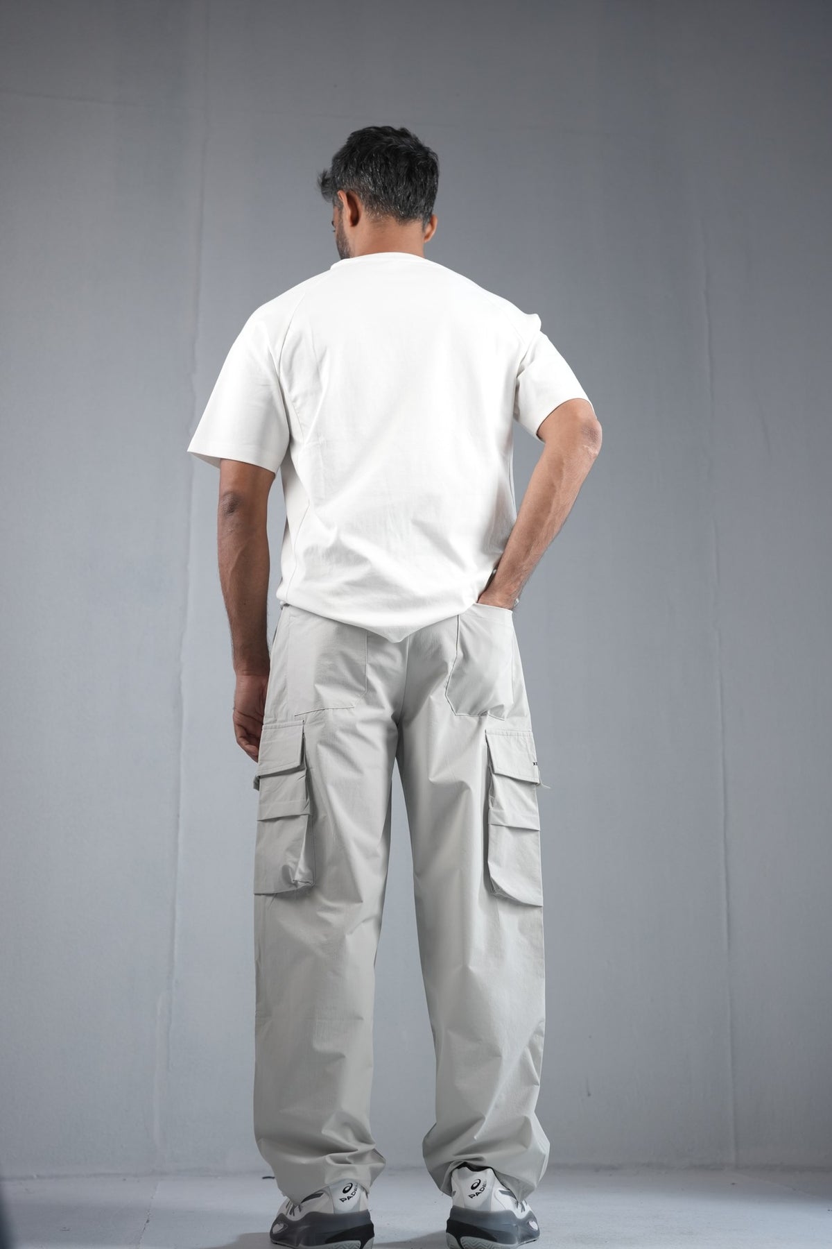 Premium Multi-Pocket Cargo Pant For Men & Women – Light Grey, worn by model 3 | BYSPORTS