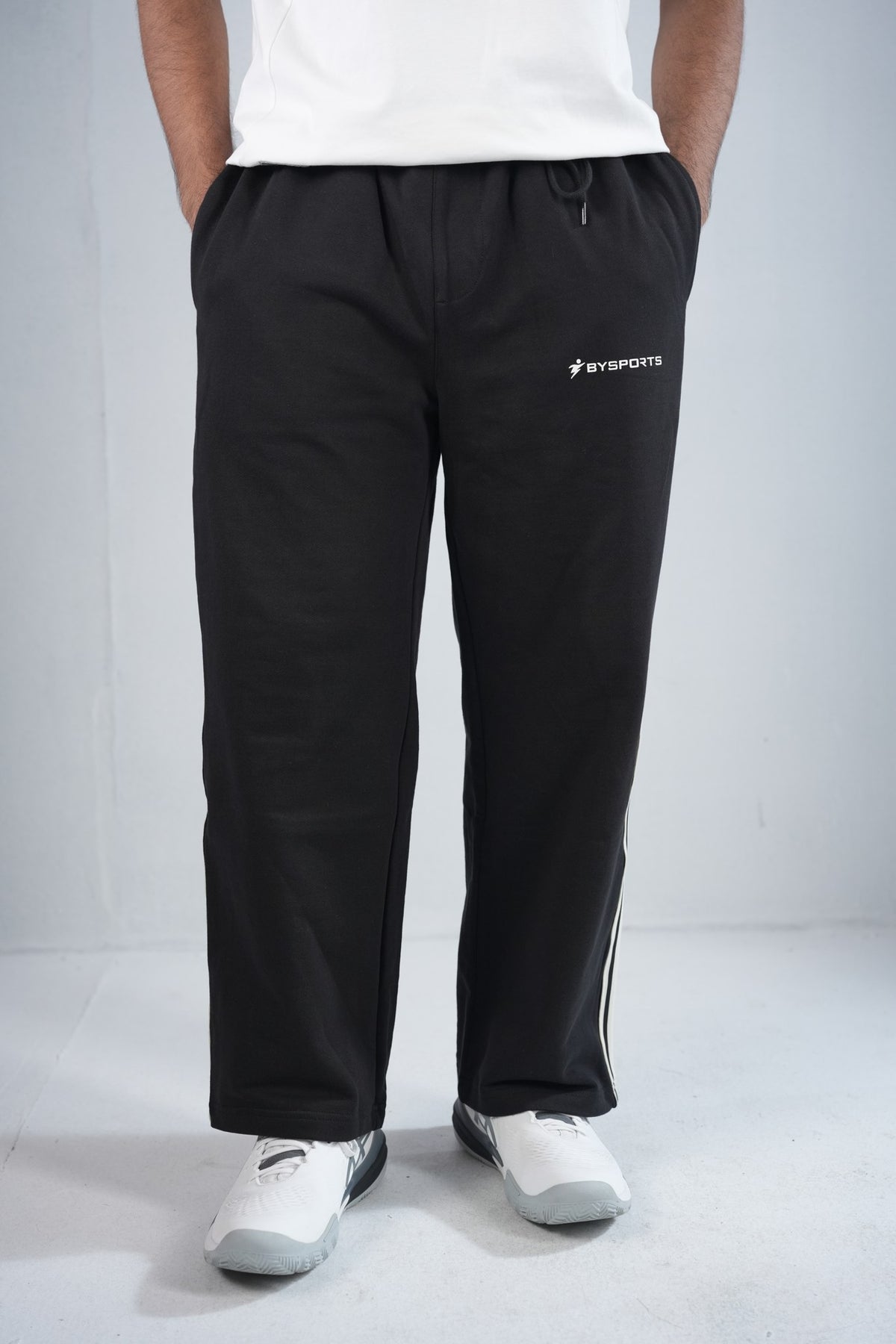 BYSPORTS Premium Side-Stripe Trouser For Men & Women – Black, worn by model 3 | BYSPORTS