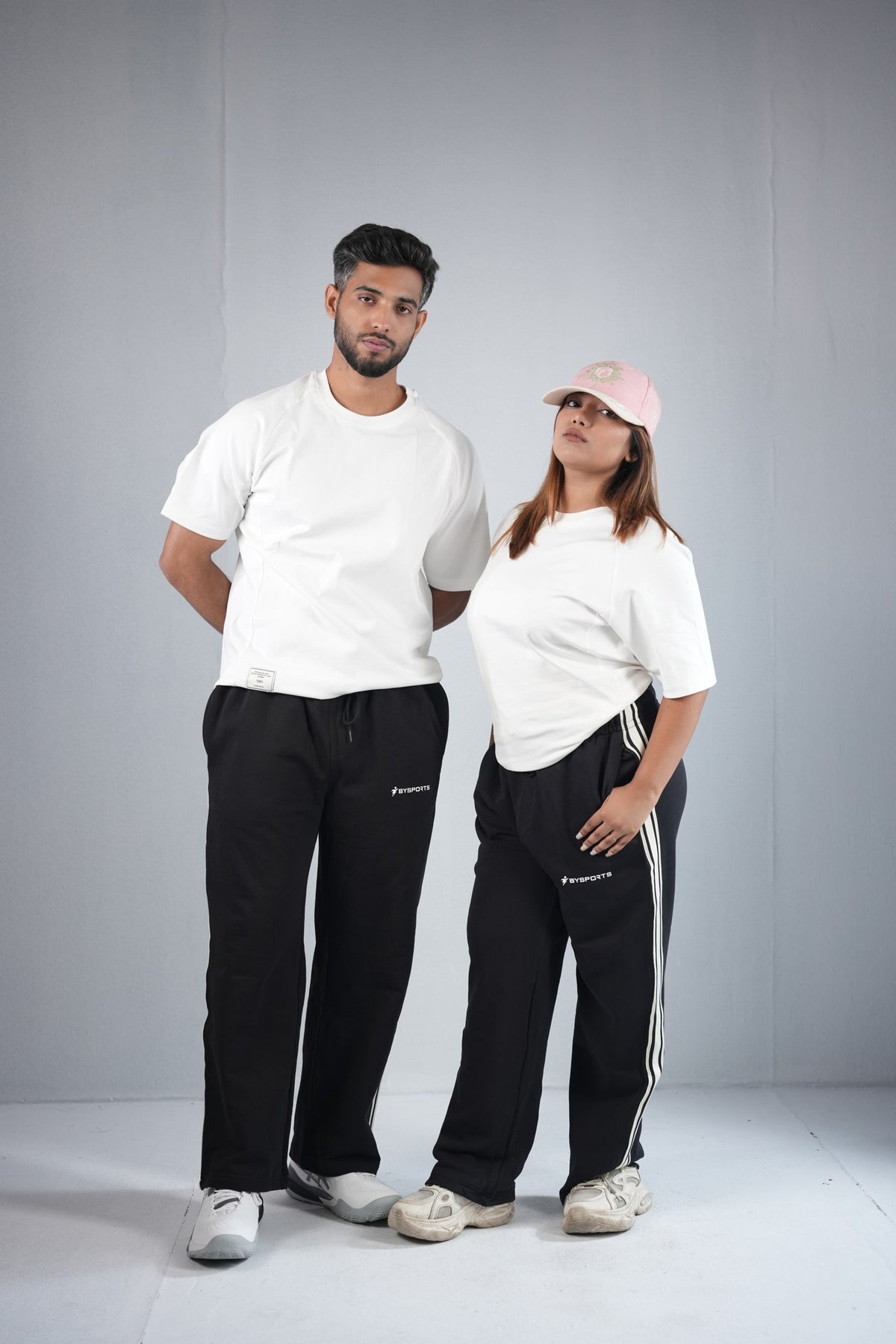 BYSPORTS Premium Side-Stripe Trouser For Men & Women – Black, worn by male and female models 2 | BYSPORTS