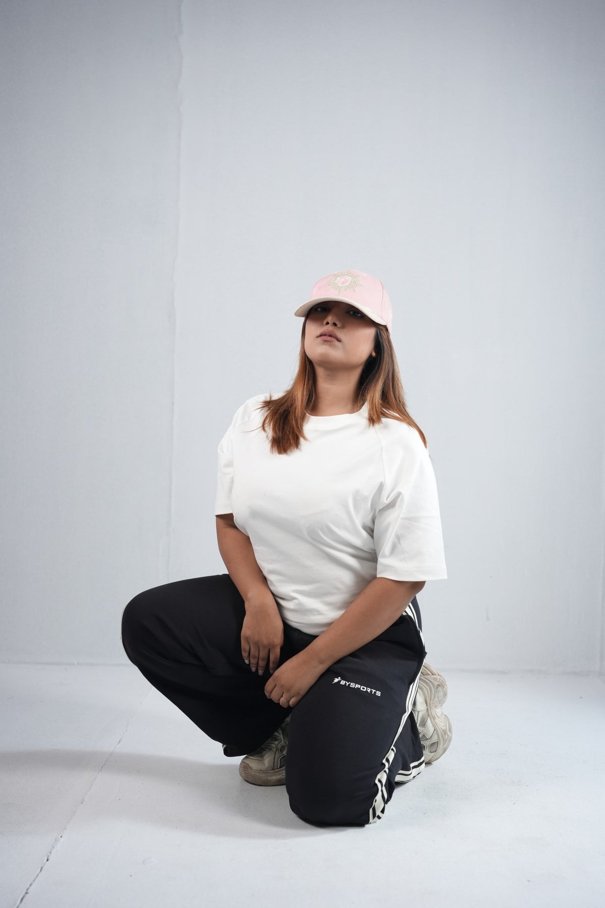 BYSPORTS Premium Side-Stripe Trouser For Men & Women – Black, lifestyle shot on model 2 | BYSPORTS