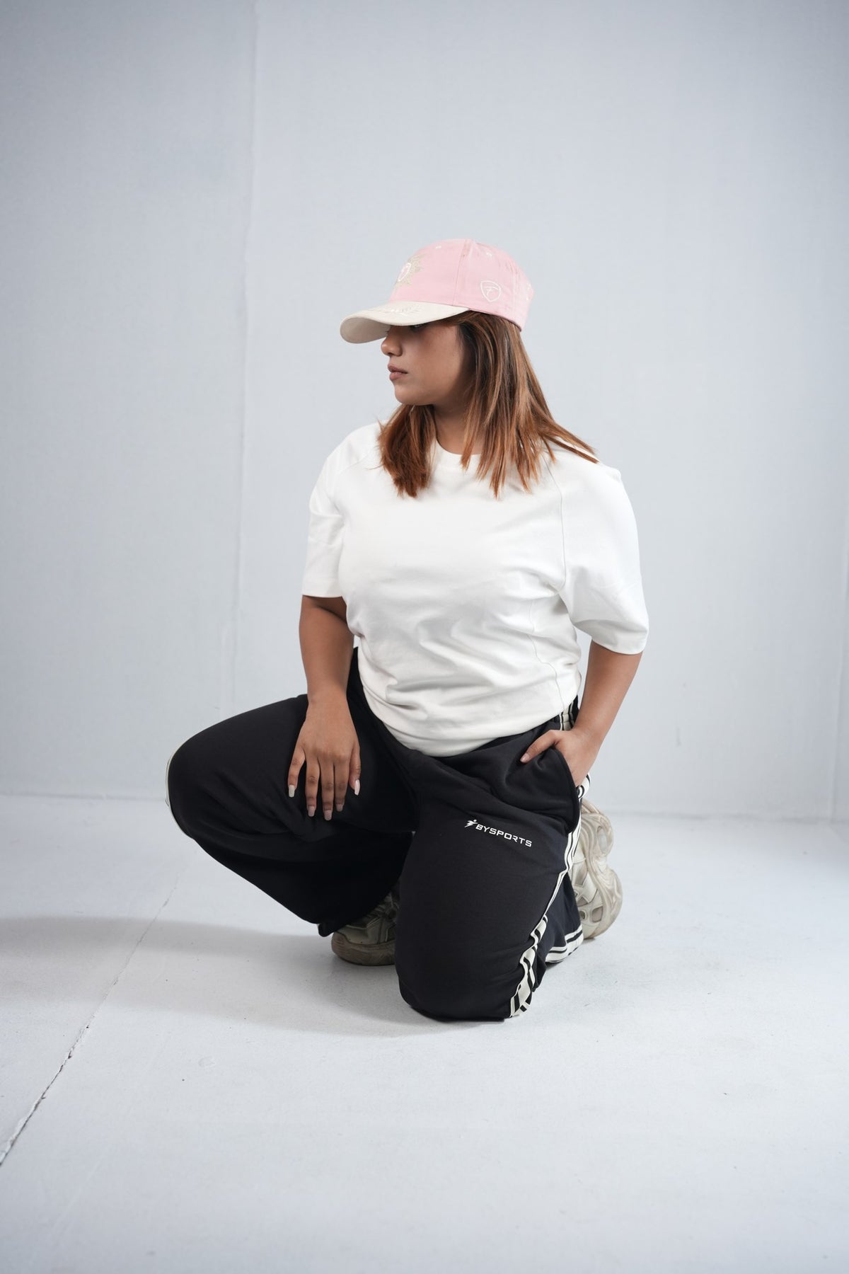 BYSPORTS Premium Side-Stripe Trouser For Men & Women – Black, lifestyle shot on model 3 | BYSPORTS