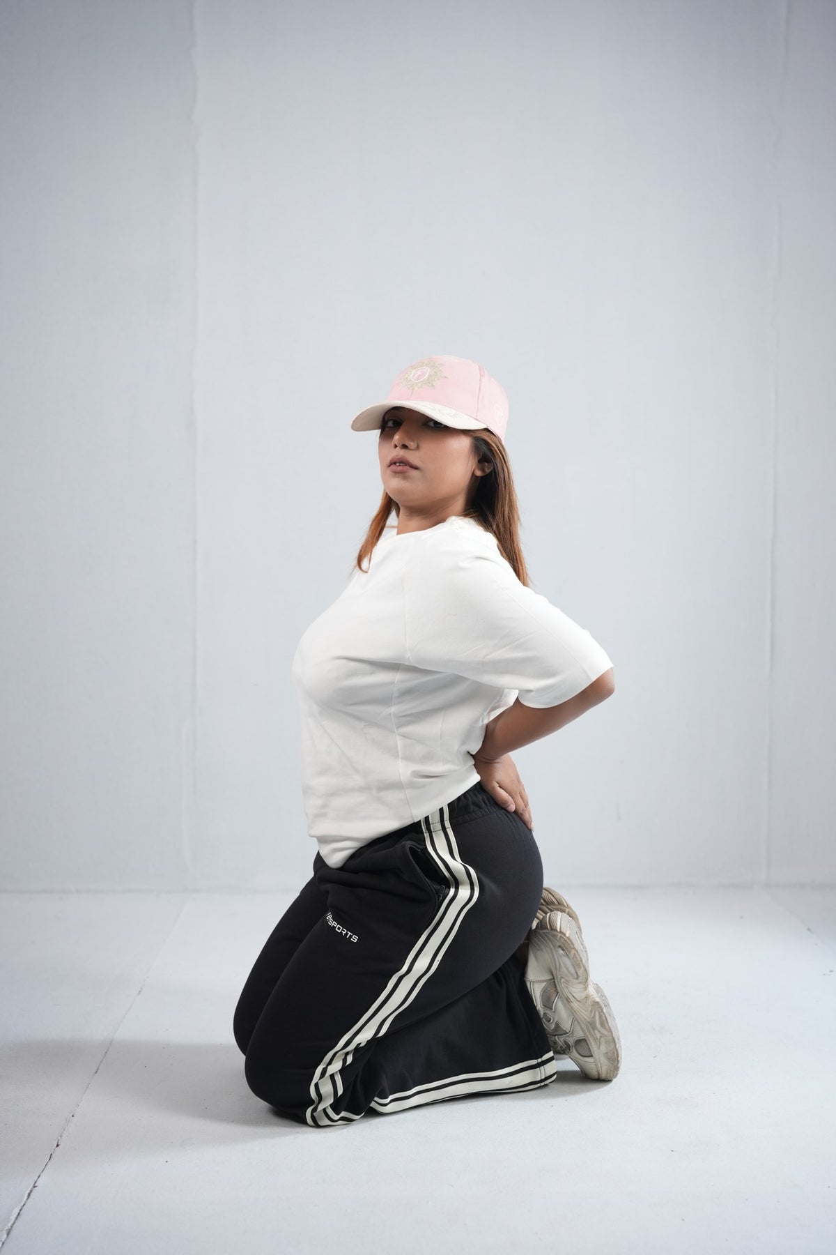 BYSPORTS Premium Side-Stripe Trouser For Men & Women – Black, lifestyle shot on model 5 | BYSPORTS