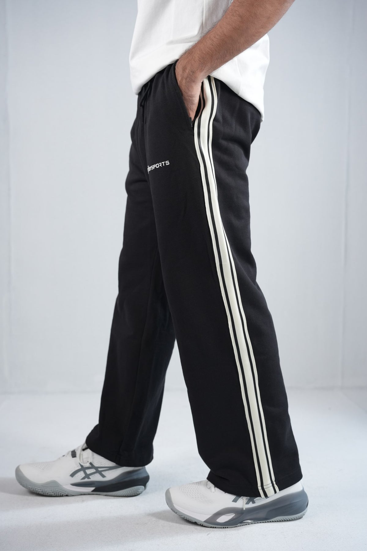 BYSPORTS Premium Side-Stripe Trouser For Men & Women – Black, side view on model | BYSPORTS