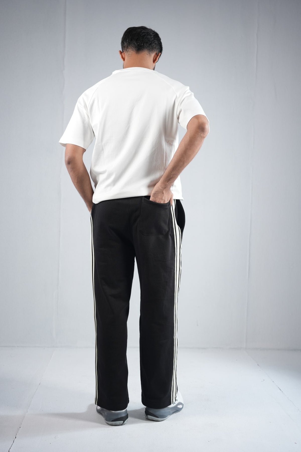 BYSPORTS Premium Side-Stripe Trouser For Men & Women – Black, worn by model 5 | BYSPORTS