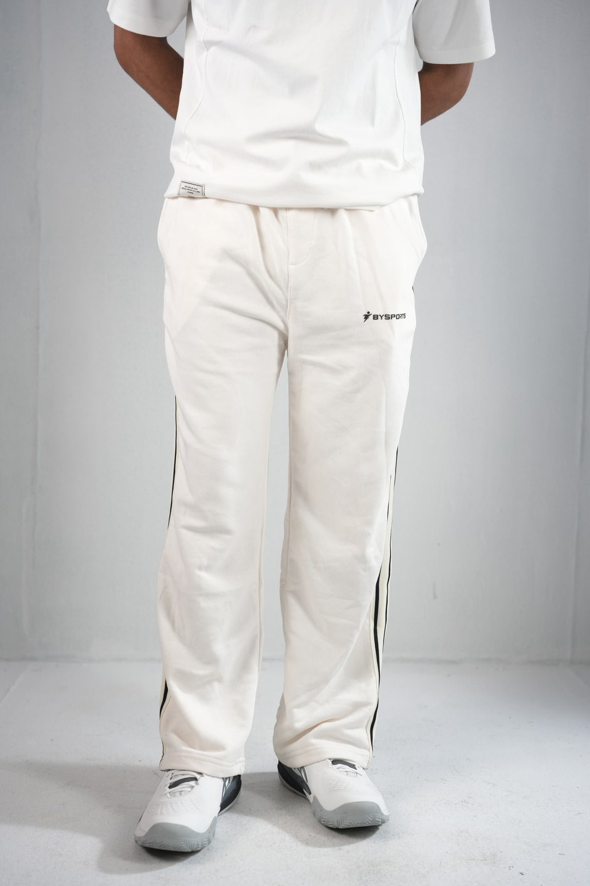BYSPORTS Premium Side-Stripe Trouser For Men & Women – Cream, worn by model 2 | BYSPORTS