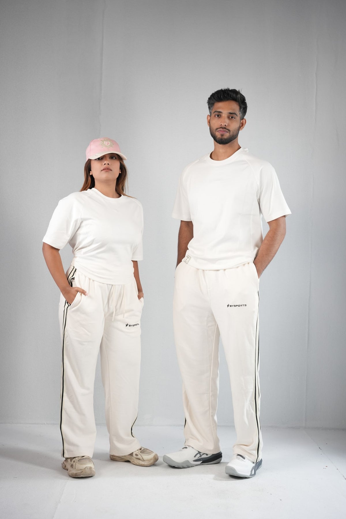 BYSPORTS Premium Side-Stripe Trouser For Men & Women – Cream, worn by male and female models 2 | BYSPORTS