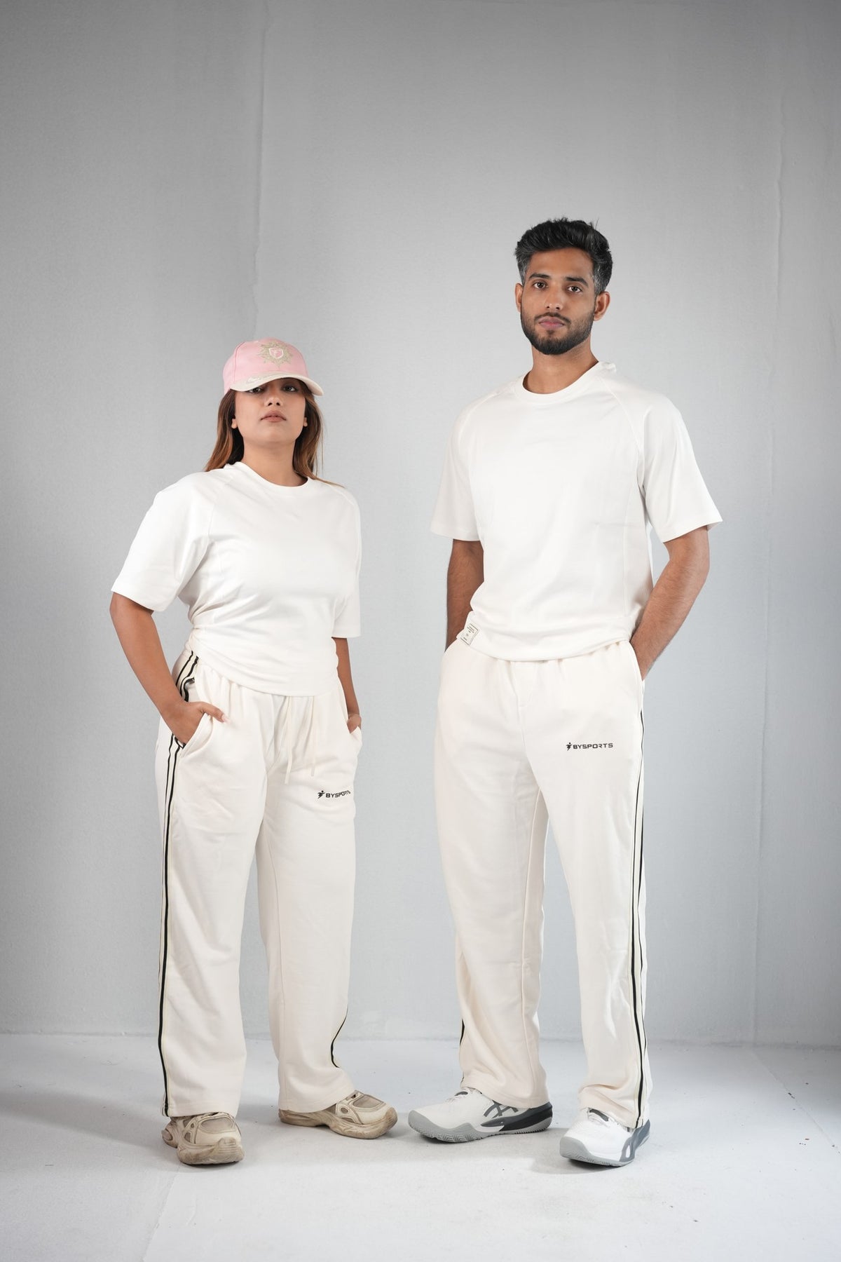 BYSPORTS Premium Side-Stripe Trouser For Men & Women – Cream, worn by male and female models 3 | BYSPORTS