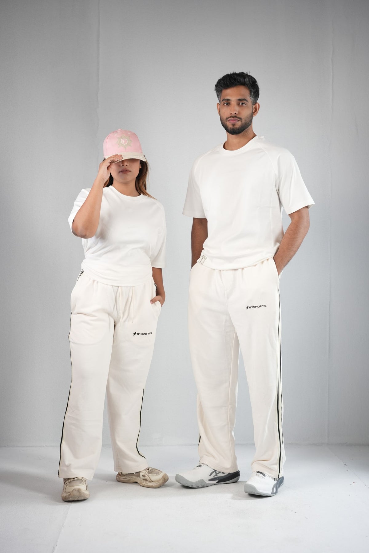 BYSPORTS Premium Side-Stripe Trouser For Men & Women – Cream, worn by male and female models 4 | BYSPORTS