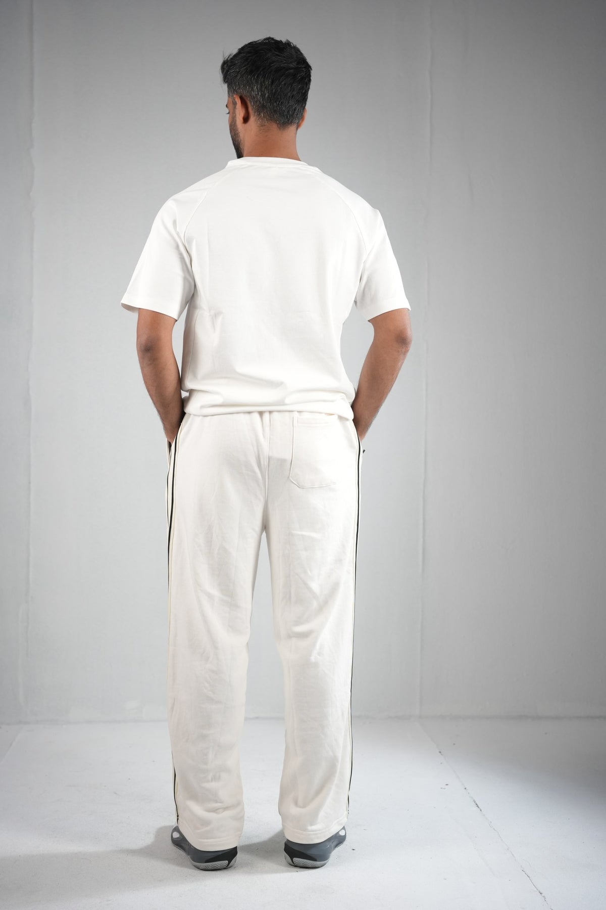 BYSPORTS Premium Side-Stripe Trouser For Men & Women – Cream, worn by model 3 | BYSPORTS