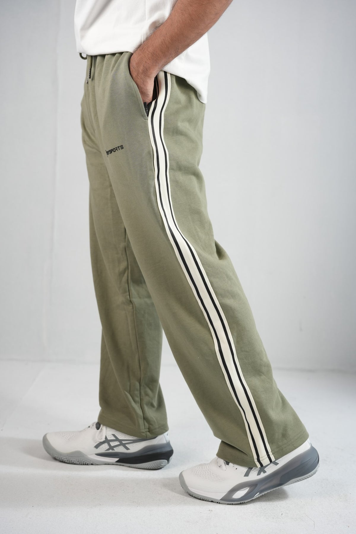 BYSPORTS Premium Side-Stripe Trouser For Men & Women – Olive, side view on model 2 | BYSPORTS