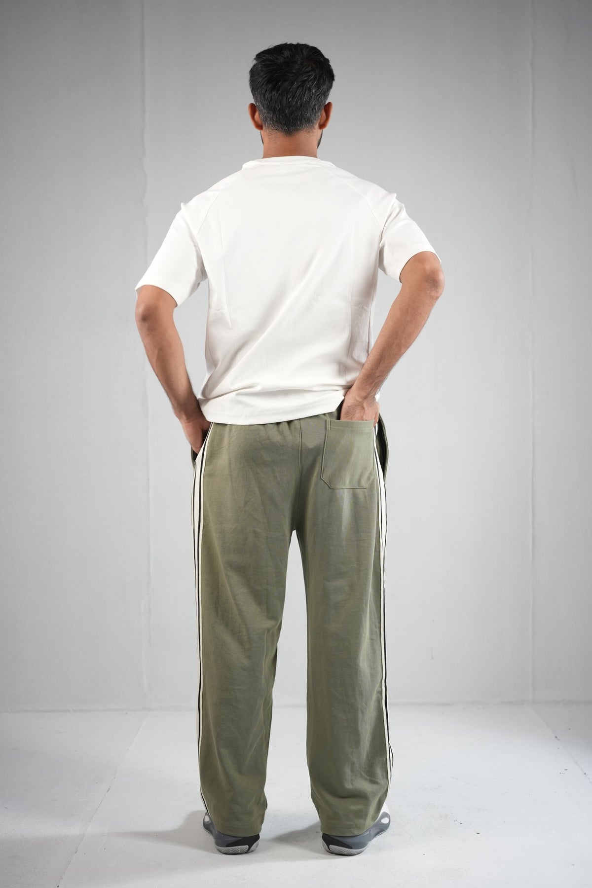BYSPORTS Premium Side-Stripe Trouser For Men & Women – Olive, worn by model 4 | BYSPORTS